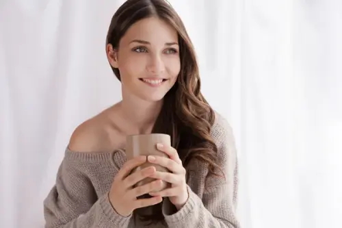 depositphotos 53831529 stock photo beautiful woman drinking coffee sitting